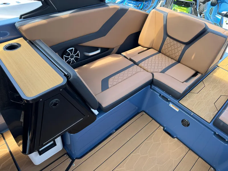 Slide: The Image of 2024 Yamaha Boats 255XD interior with tan seating and modern design. - 22
