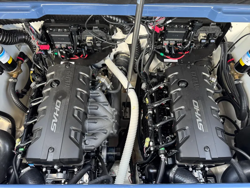 Slide: The Image of 2024 Yamaha Boats 255XD engine compartment with dual SVHO engines. - 28