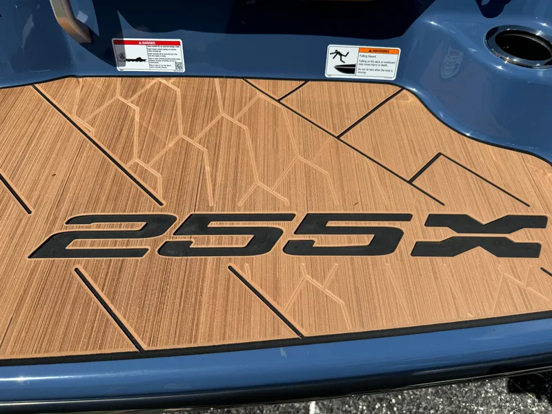 Slide: The Image of 2024 Yamaha Boats 255XD deck with logo and safety warnings. - 5