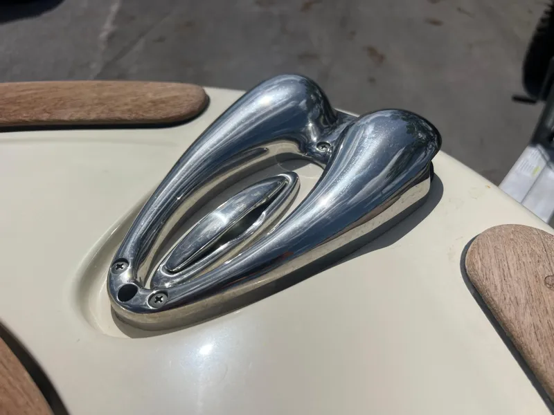 Slide: The Image of Close-up of a 2019 Chris-Craft Corsair 27 boat's polished metal cleat. - 13