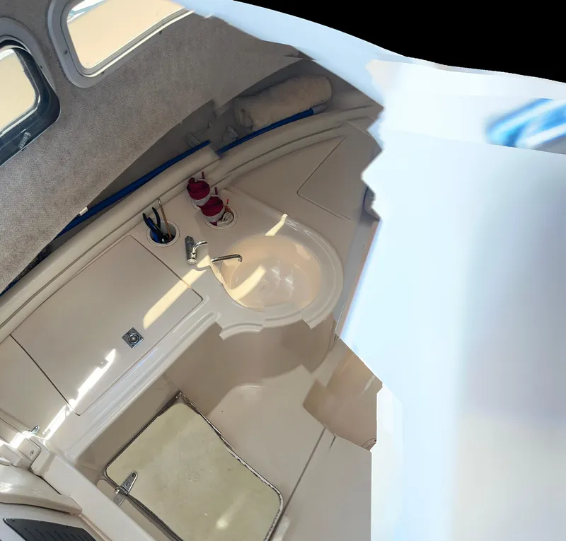 Slide: The Image of Dashboard of 2004 Grady-White Gulfstream 232 with Simrad display and compass. - 11