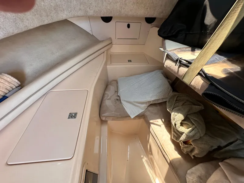 Slide: The Image of 2004 Grady-White Gulfstream 232 boat interior with sink and storage compartments. - 14