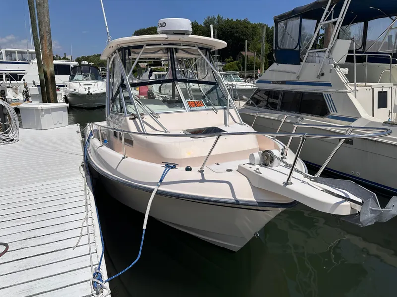 Slide: The Image of 2004 Grady-White Gulfstream 232 boat docked, with "For Sale" sign visible. - 20