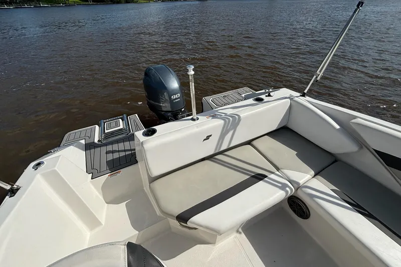 Slide: The Image of 2021 Starcraft SVX 171 OB boat with seating and outboard motor on a lake. - 13