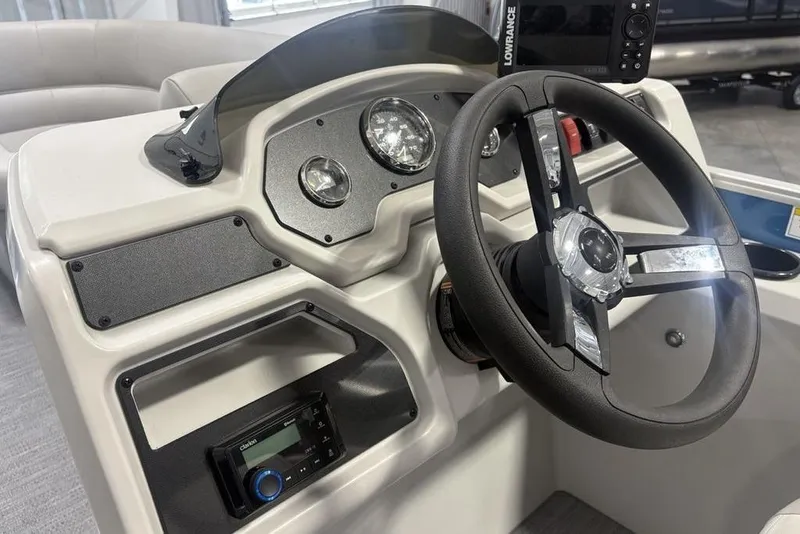 Slide: The Image of Steering console of 2025 Godfrey Xperience 2286 SBX boat with modern controls. - 11