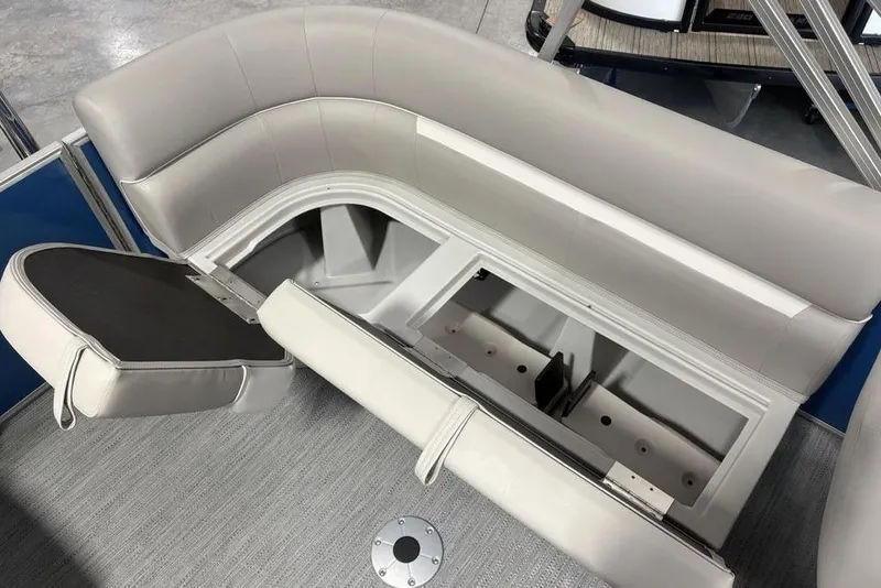 Slide: The Image of 2025 Godfrey Xperience 2286 SBX boat seating with storage compartment open. - 16