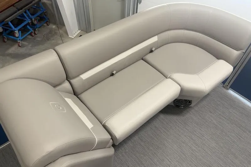 Slide: The Image of Luxurious seating on 2025 Godfrey Xperience 2286 SBX pontoon boat, featuring sleek beige upholstery. - 6