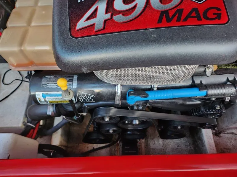 Slide: The Image of Engine compartment of a 2003 Baja 24 H2X Boss boat, featuring a 496 MAG engine. - 7