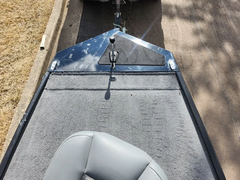 Slide: The Image of 2021 Tracker Bass Tracker Classic XL boat deck with gray seating and carpet. - 15