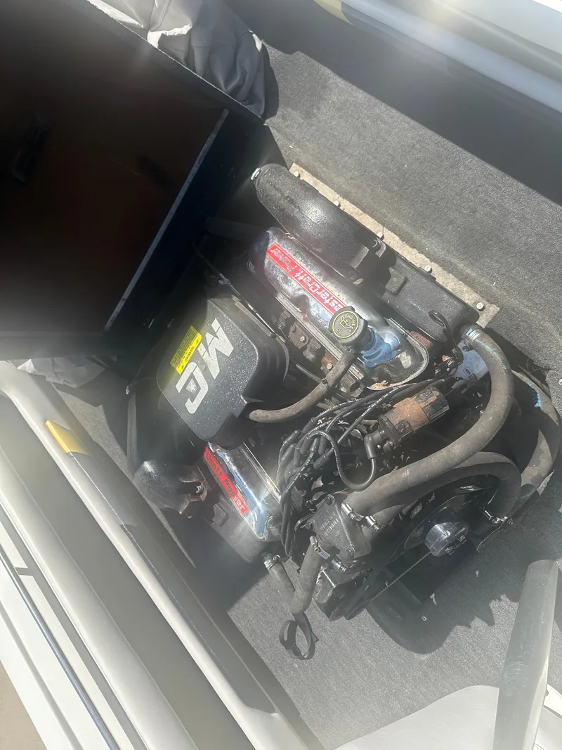 Slide: The Image of 1989 MasterCraft ProStar 190 engine compartment with visible components and wiring. - 11