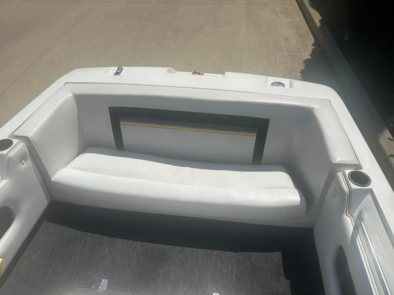 Slide: The Image of 1989 MasterCraft ProStar 190 boat interior with white seating and cup holders. - 5