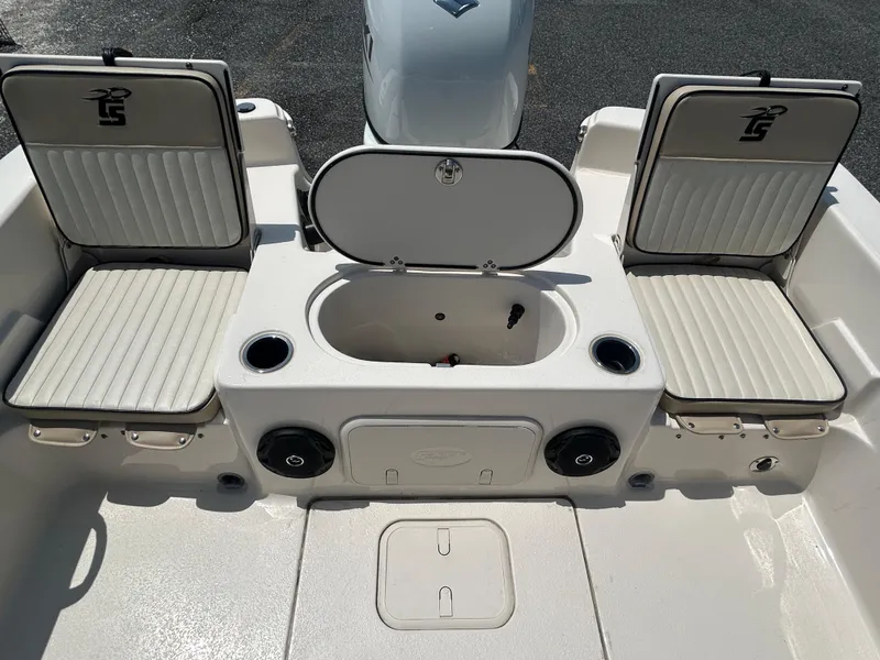 Slide: The Image of 2022 Carolina Skiff 19 LS boat interior with seating and storage compartments. - 13