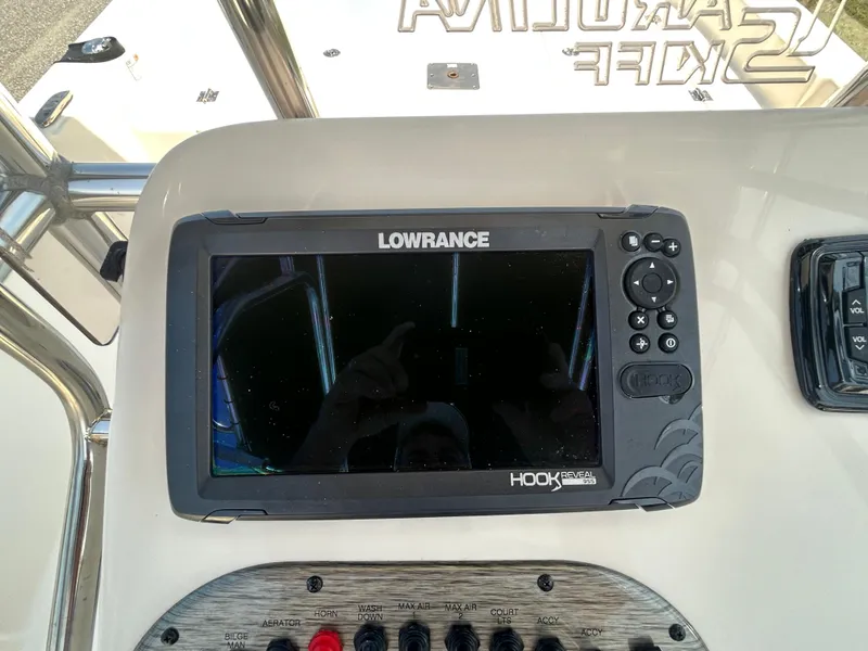 Slide: The Image of 2022 Carolina Skiff 19 LS dashboard with Lowrance Hook Reveal fish finder. - 17
