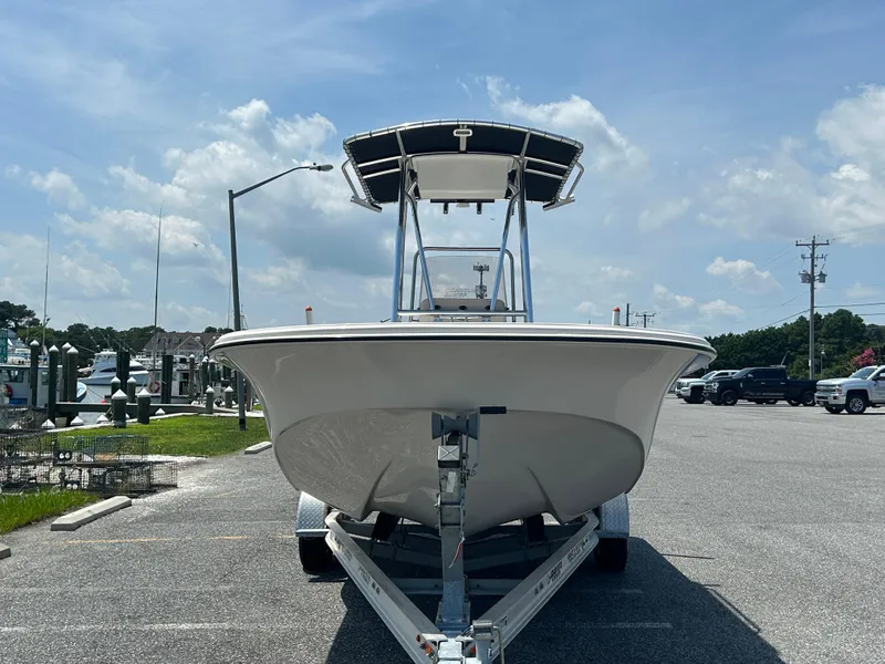 Slide: The Image of 2022 Carolina Skiff 19 LS boat on trailer in sunny parking lot. - 2