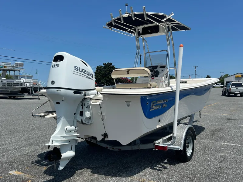 Slide: The Image of 2022 Carolina Skiff 19 LS boat with Suzuki 115 outboard motor on trailer. - 7