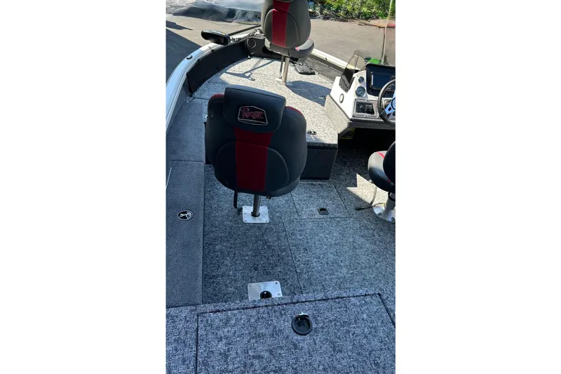 Slide: The Image of 2025 Ranger VS1682SC Angler boat interior with seating and control console. - 2