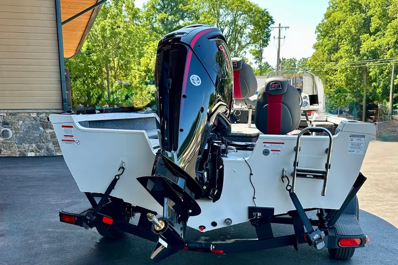 Slide: The Image of 2025 Ranger VS1682SC Angler boat with powerful outboard motor, parked outdoors. - 3
