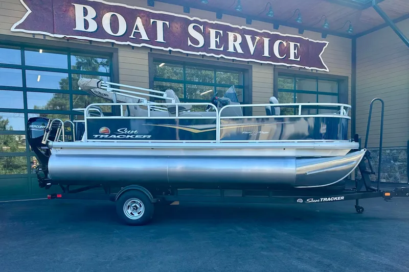 Slide: The Image of 2025 Sun Tracker Bass Buggy 18 DLX pontoon boat at boat service center. - 90