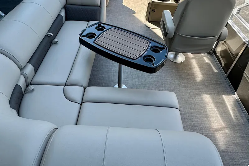 Slide: The Image of Interior of 2025 Sun Tracker Party Barge 18 DLX with seating and table. - 3