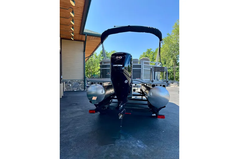 Slide: The Image of 2025 Sun Tracker Party Barge 18 DLX pontoon boat with Mercury outboard motor. - 5