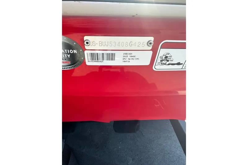 Slide: The Image of 2025 Tahoe T16 red vehicle identification plate with serial number and manufacturer details. - 61