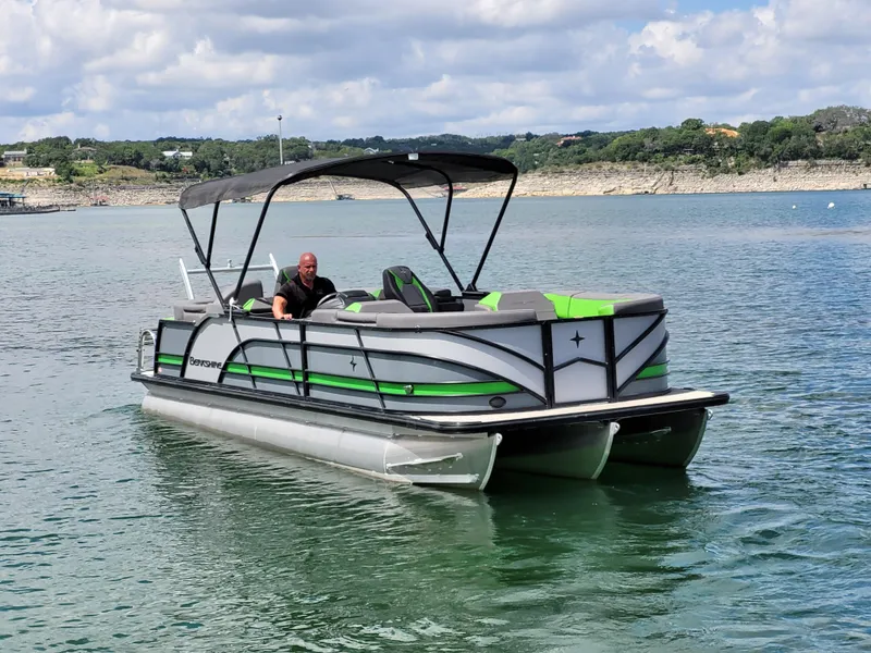 The Image of 2023 Berkshire 25RFX STS 3.0+ pontoon boat on a scenic lake. - 0
