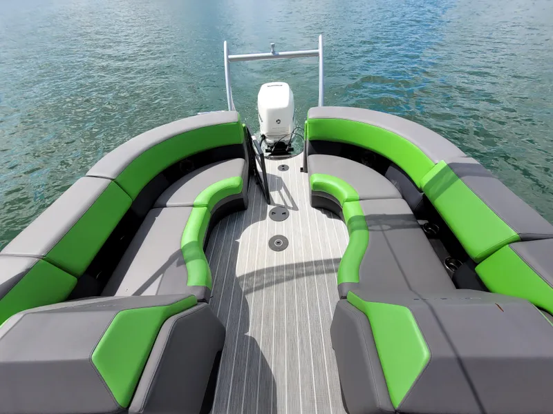 Slide: The Image of 2023 Berkshire 25RFX STS 3.0+ pontoon boat with green and gray seating on water. - 20