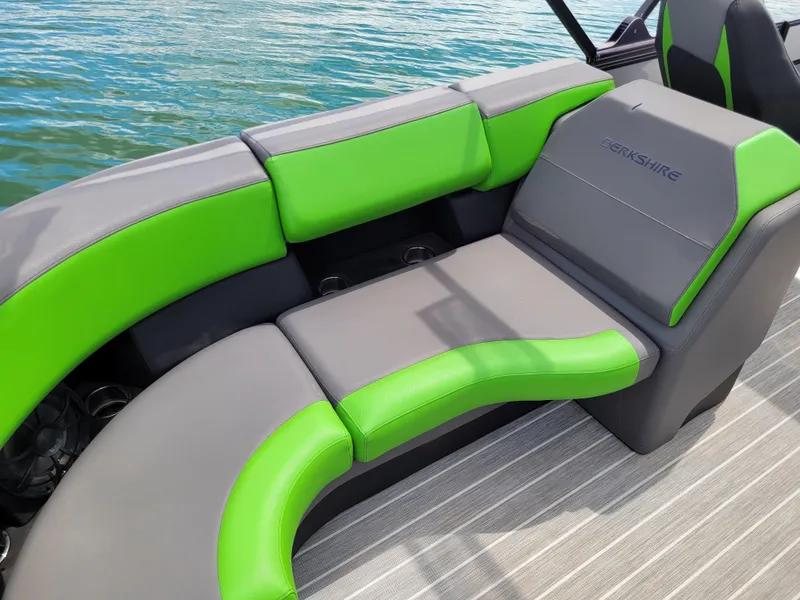 Slide: The Image of 2023 Berkshire 25RFX STS 3.0+ boat interior with green and gray seating. - 22