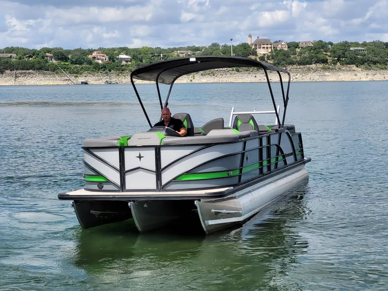Slide: The Image of 2023 Berkshire 25RFX STS 3.0+ pontoon boat on a scenic lake. - 4