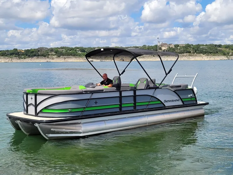 Slide: The Image of 2023 Berkshire 25RFX STS 3.0+ pontoon boat on a scenic lake. - 6
