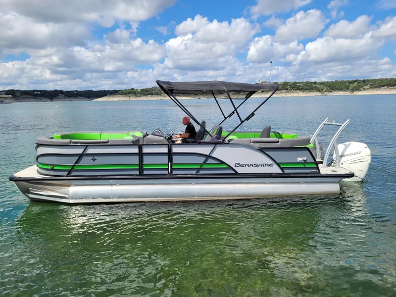 Slide: The Image of 2023 Berkshire 25RFX STS 3.0+ pontoon boat on a scenic lake. - 8