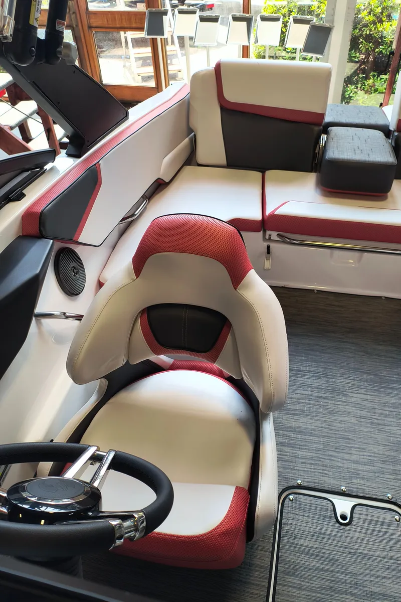 Slide: The Image of Interior of 2023 Scarab 195 ID boat with modern seating and steering wheel. - 20