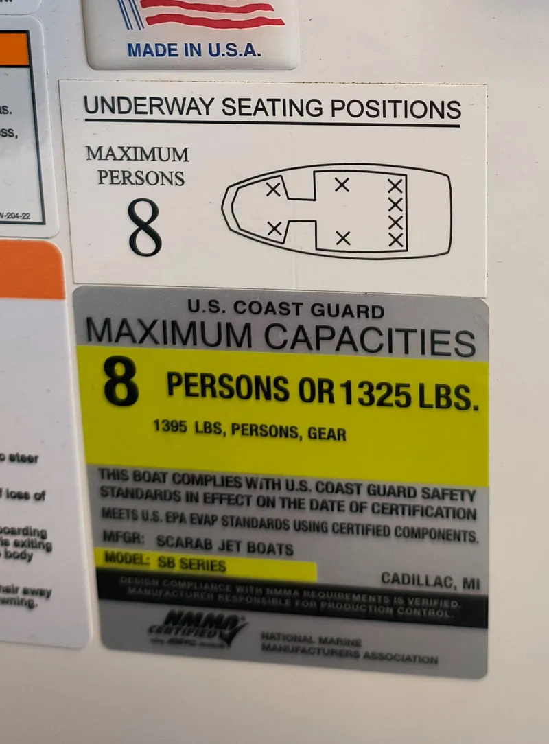 Slide: The Image of Scarab 195 ID 2023 boat capacity label: 8 persons or 1325 lbs, U.S. Coast Guard compliant. - 32