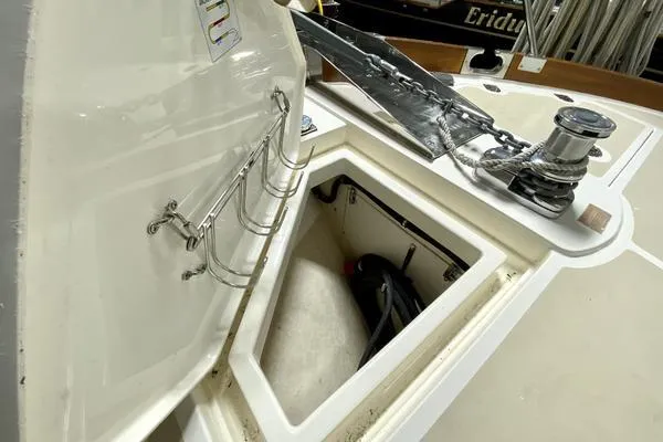 Slide: The Image of 2011 Grand Banks 46 Eastbay SX cruising on open water under a partly cloudy sky. - 12