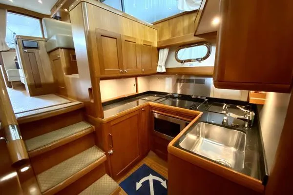 Slide: The Image of Aerial view of 2011 Grand Banks 46 Eastbay SX yacht on open water. - 25