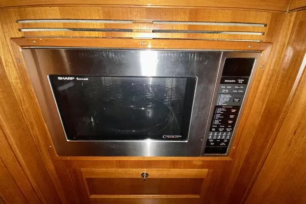 Slide: The Image of 2011 Grand Banks 46 Eastbay SX yacht cruising on open water. - 27