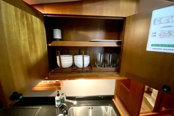 Slide: The Image of 2011 Grand Banks 46 Eastbay SX yacht with spacious deck and elegant seating. - 29