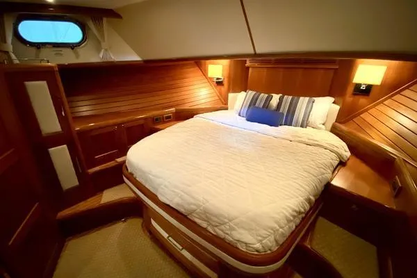 Slide: The Image of 2011 Grand Banks 46 Eastbay SX yacht on calm waters under blue sky. - 35