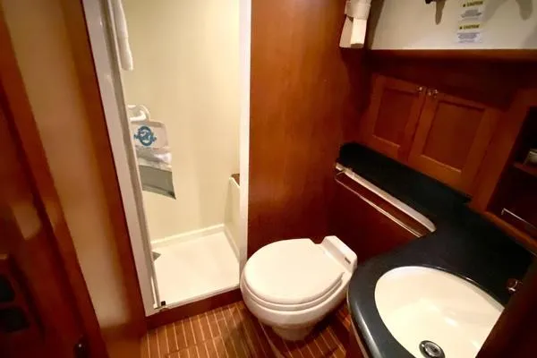 Slide: The Image of Luxurious interior of 2011 Grand Banks 46 Eastbay SX yacht with plush seating and scenic windows. - 38