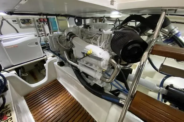 Slide: The Image of Helm of 2011 Grand Banks 46 Eastbay SX with navigation screens and steering wheel. - 44