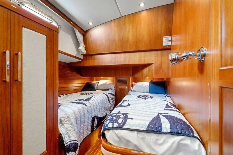 Slide: The Image of Luxurious 2011 Grand Banks 46 Eastbay SX cabin with twin beds and nautical decor. - 55
