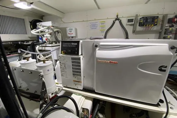 Slide: The Image of Engine room of 2011 Grand Banks 46 Eastbay SX with Cummins Onan marine generator. - 62