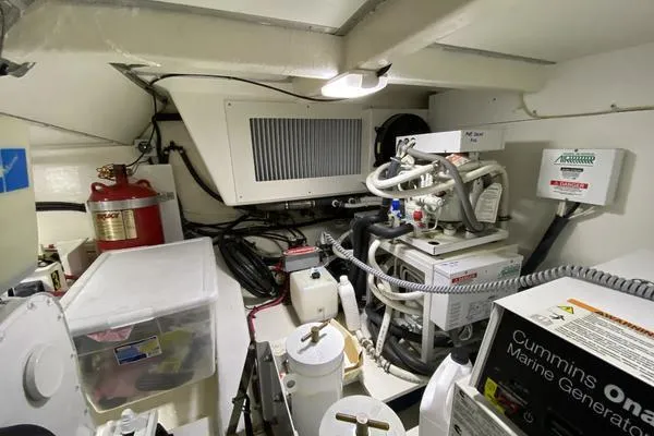 Slide: The Image of Engine room of 2011 Grand Banks 46 Eastbay SX with Cummins Onan generator and equipment. - 63