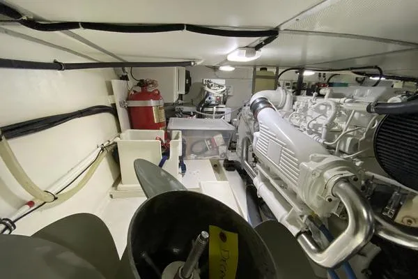 Slide: The Image of Engine room of 2011 Grand Banks 46 Eastbay SX with visible machinery and fire extinguisher. - 64