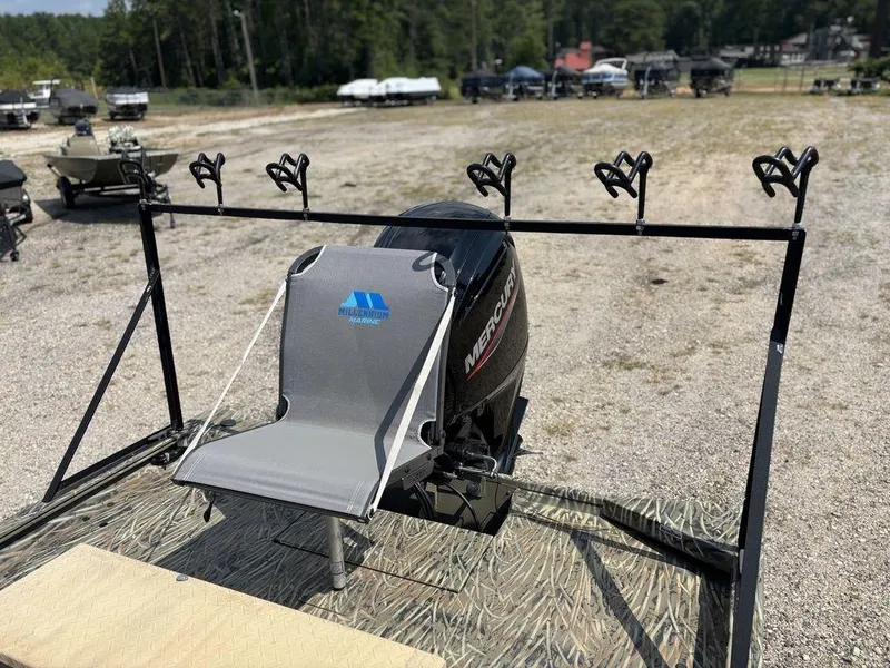 Slide: The Image of 2025 Tracker GRIZZLY® 1860 CC boat with Mercury engine and fishing rod holders. - 12