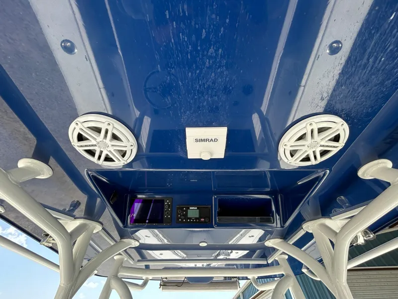Slide: The Image of 2019 Yellowfin 36 Offshore boat interior with Simrad electronics and speakers. - 10