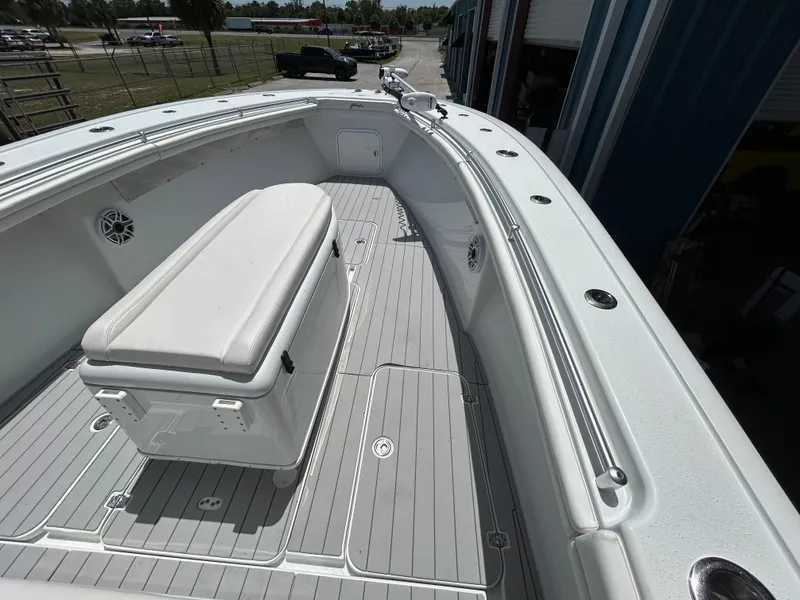 Slide: The Image of 2019 Yellowfin 36 Offshore boat deck with seating and storage. - 12