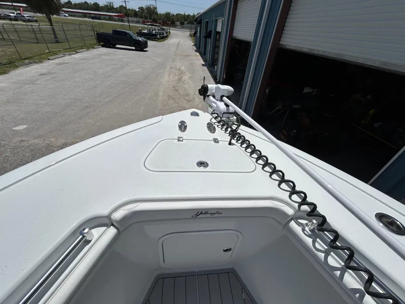 Slide: The Image of 2019 Yellowfin 36 Offshore boat bow with coiled cable and storage compartment. - 15