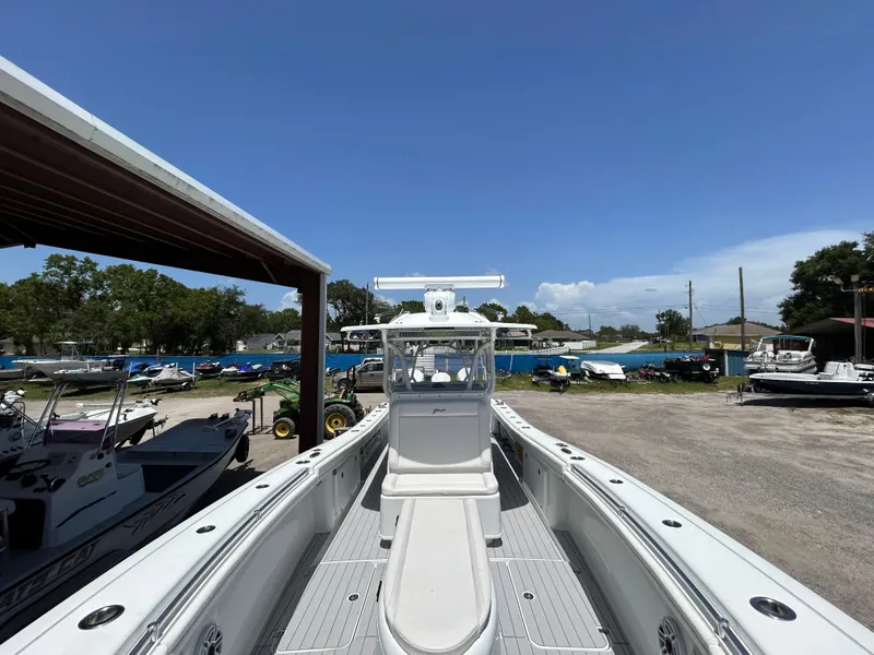 Slide: The Image of 2019 Yellowfin 36 Offshore boat docked under clear blue sky. - 17