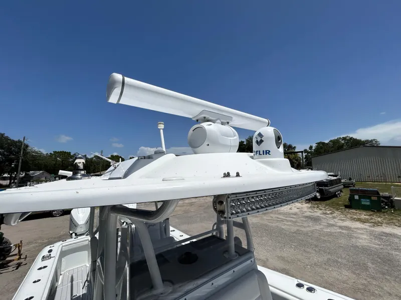 Slide: The Image of 2019 Yellowfin 36 Offshore boat with radar and FLIR system under clear blue sky. - 20